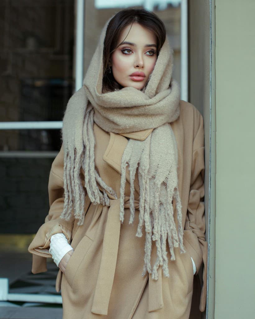 Camel coat with chunky knit scarf